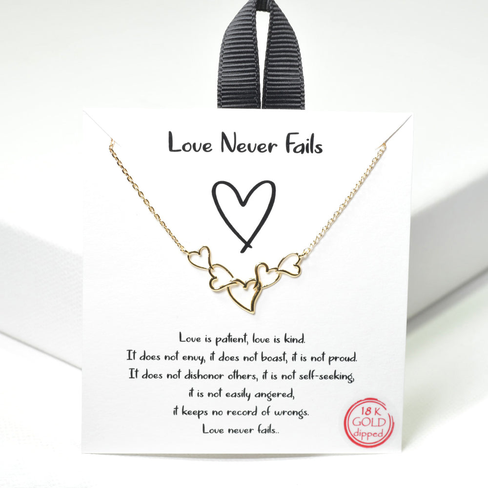 "Love Never Fails" dainty heart necklace